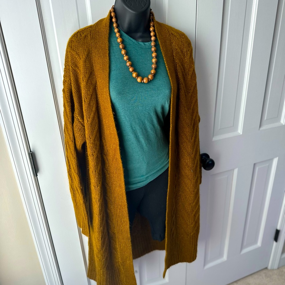 A New Day Long Cardigan Size XS
75% Acrylic- 25% Nylon